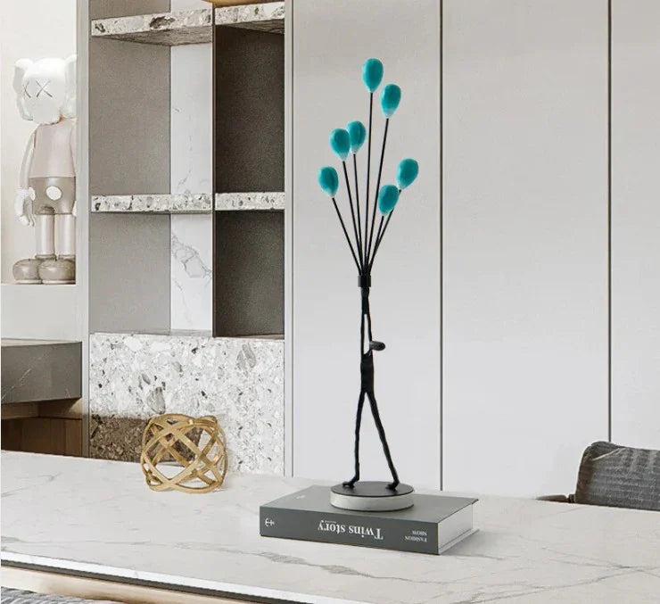 MAN HOLDING BALLOONS IN JOY